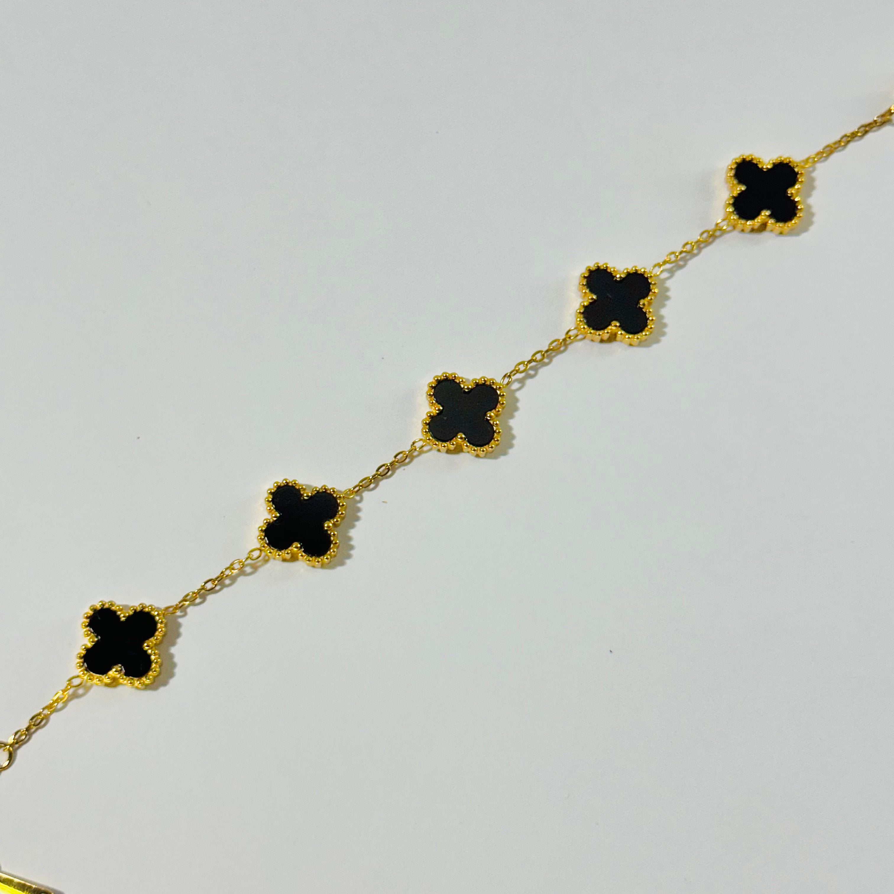 Elegant Black and Gold Clover Bracelet